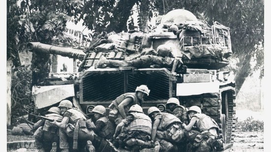 hue_1968_tet_offensive__us_marines_take_cover_behind_a_tank-1024x576 (1).jpg